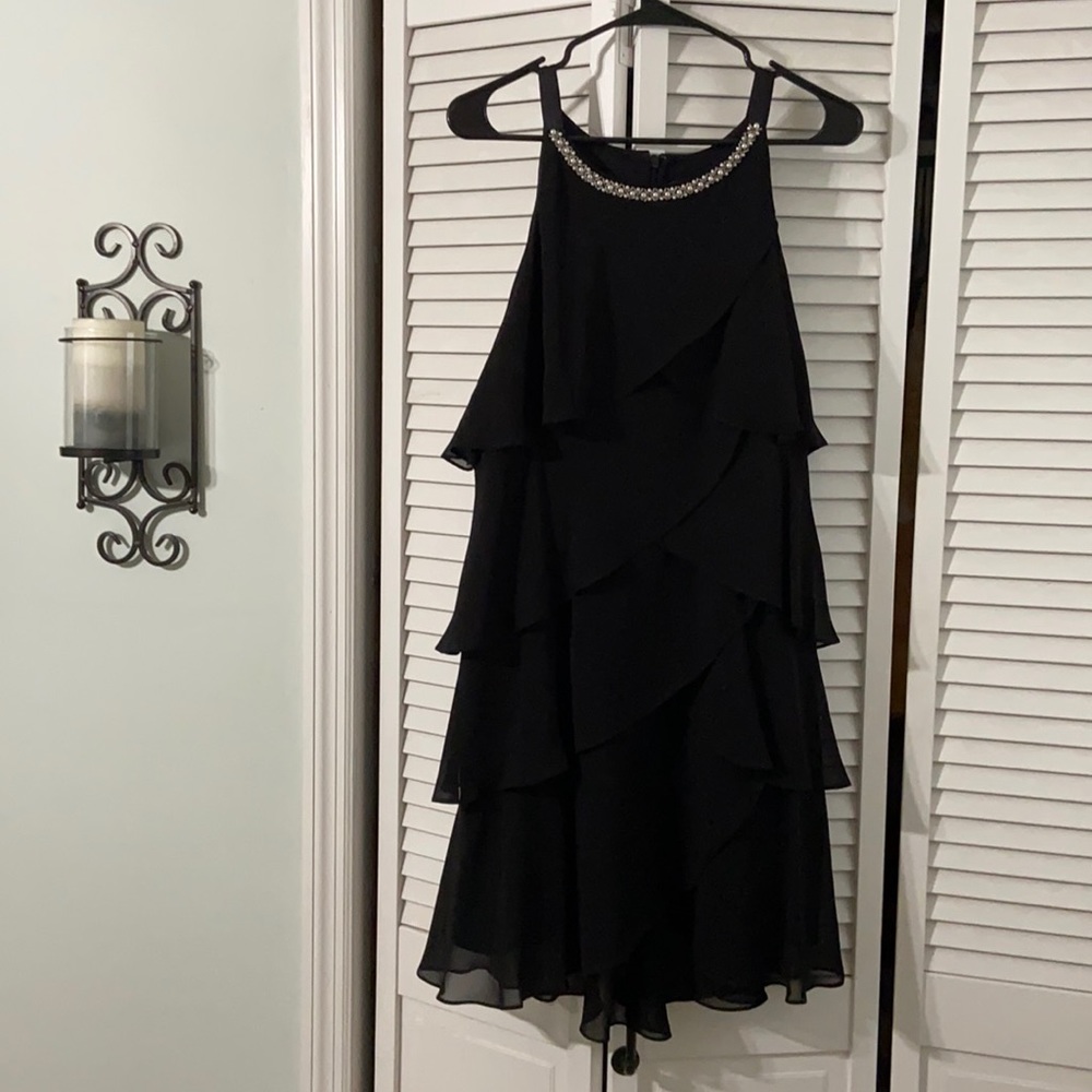 Tiered black cocktail dress w detailed neckline